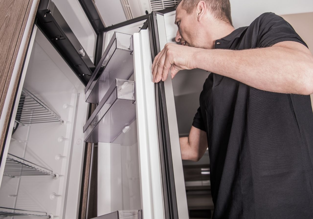 Frustrated RV owner looking at a broken stove while camping near Disney