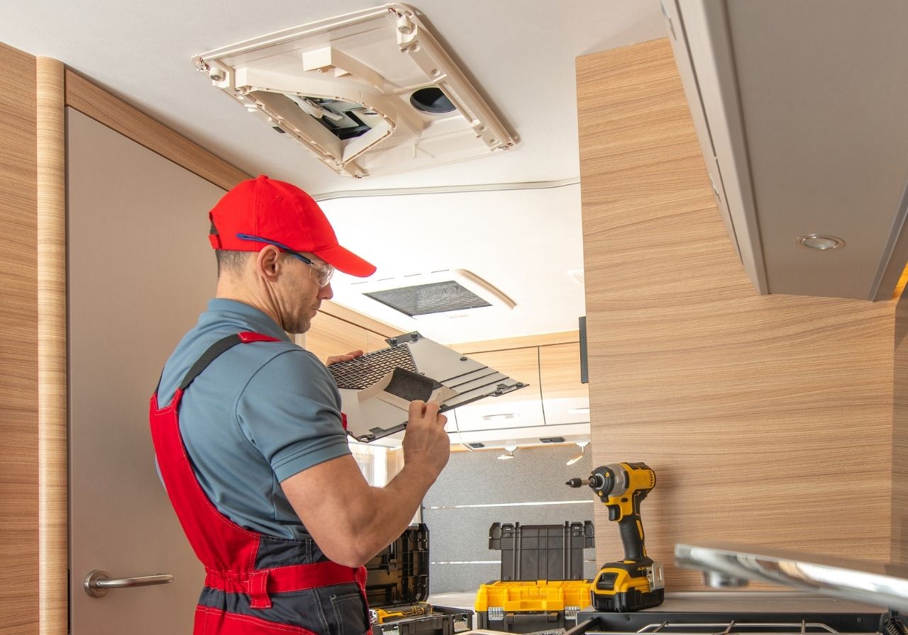On-site RV air conditioning repair tools used by mobile technician
