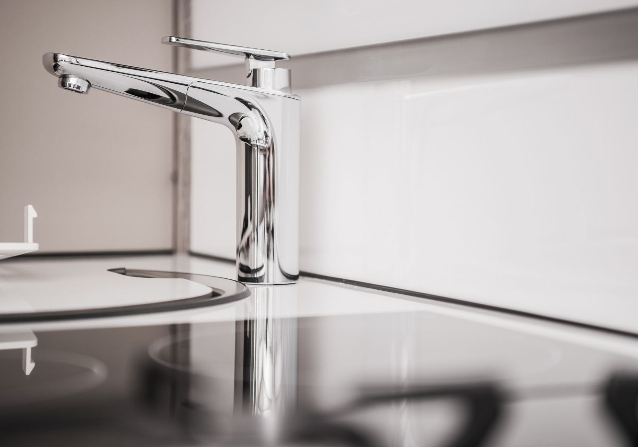 On-site RV sink repair showing plumbing tools and technician’s hands